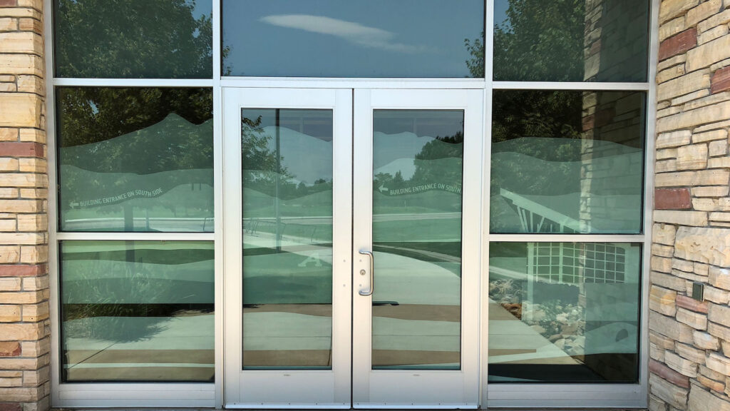 Modern glass entry doors at Platinum Mobile Force, mobile detailing & tinting in Kearny