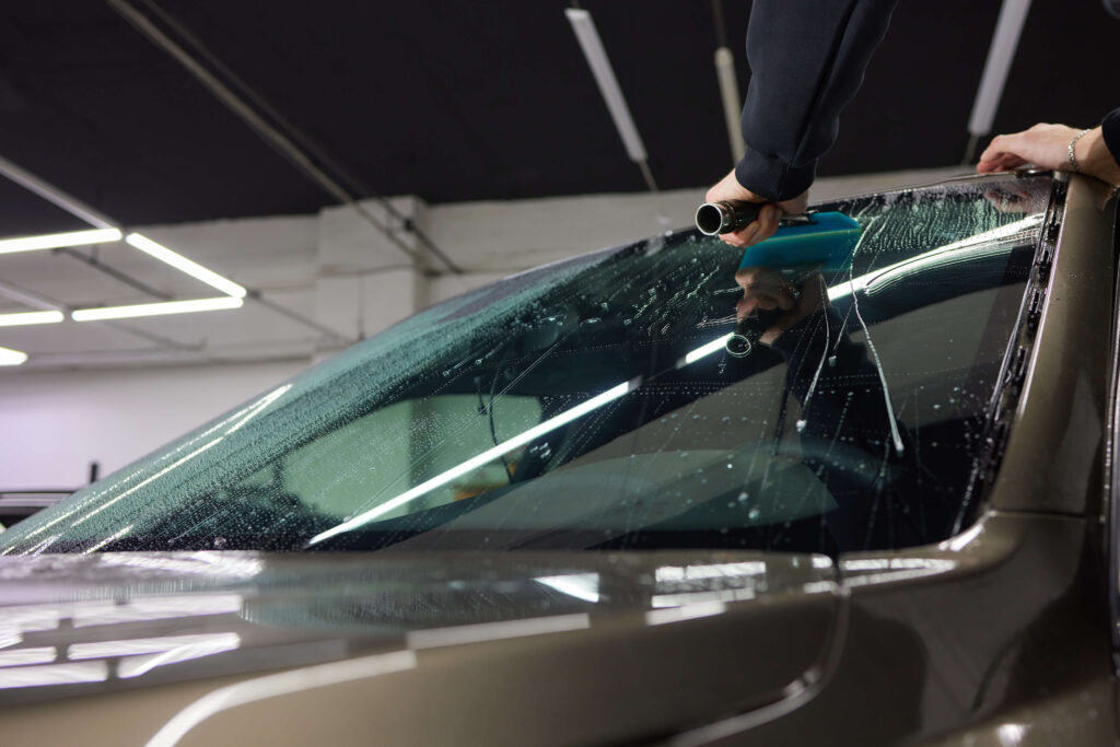 Car windshield window tint application process in Kearny NJ by Platinum Mobile Force
